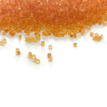 Load image into Gallery viewer, Orange Translucent- Microbeads (No Holes) 1.0mm - 1.2mm Caviar Beads https://www.artbeecrafts.com/products/orange-translucent-microbeads-no-holes-1-0mm-1-2mm-caviar-beads Orange Translucent- Microbeads 1.0mm - 1.2mm- No Holes Caviar Beads Tiny but dynamic, these undrilled microbeads add a textural dimension to designs. Excellent for scrapbooking, embellishments, jewelry, nail art, and many other home or professional décor projects. Size may vary. Options sold by the weight