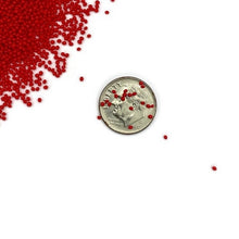 Load image into Gallery viewer, Scarlet Red- Microbeads 0.8mm - 1.2mm- No Holes Caviar Beads https://www.artbeecrafts.com/products/scarlet-red-microbeads-0-8mm-1-2mm-no-holes-caviar-beads Tiny but dynamic, these undrilled microbeads add a textural dimension to designs. Excellent for scrapbooking, embellishments, jewelry, nail art, and many other home or professional décor projects. Size may vary. Options sold by the weight